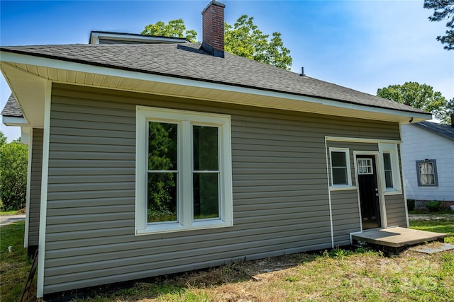 112 Hampton St, Chester, SC 29706 - view of property exterior with a chimney and roof with shingles