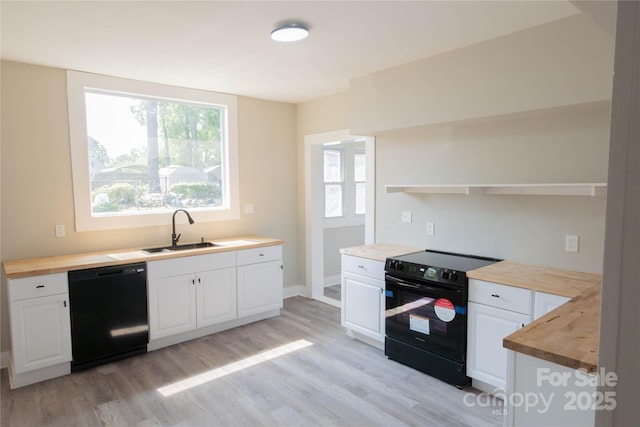 112 Hampton St, Chester, SC 29706 - kitchen featuring black appliances, a sink, wooden counters, and open shelves