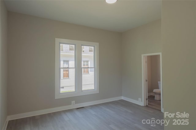 112 Hampton St, Chester, SC 29706 - empty room with wood finished floors and baseboards