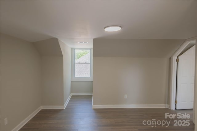 112 Hampton St, Chester, SC 29706 - additional living space with dark wood-type flooring, baseboards, and lofted ceiling