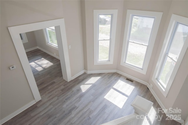 112 Hampton St, Chester, SC 29706 - empty room featuring healthy amount of natural light, wood finished floors, and baseboards