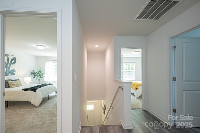 3403 Keith Dr, Charlotte, NC 28269 - hall featuring an upstairs landing, baseboards, and wood finished floors