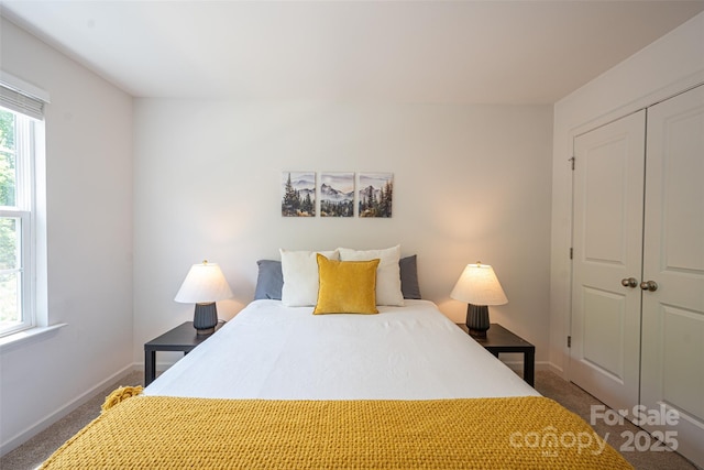 3403 Keith Dr, Charlotte, NC 28269 - carpeted bedroom featuring a closet and baseboards