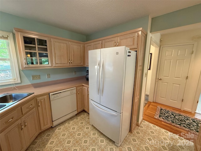333 Lentz Landing Ln, Nebo, NC 28761 - kitchen featuring white appliances, light brown cabinets, glass insert cabinets, a textured ceiling, and light countertops