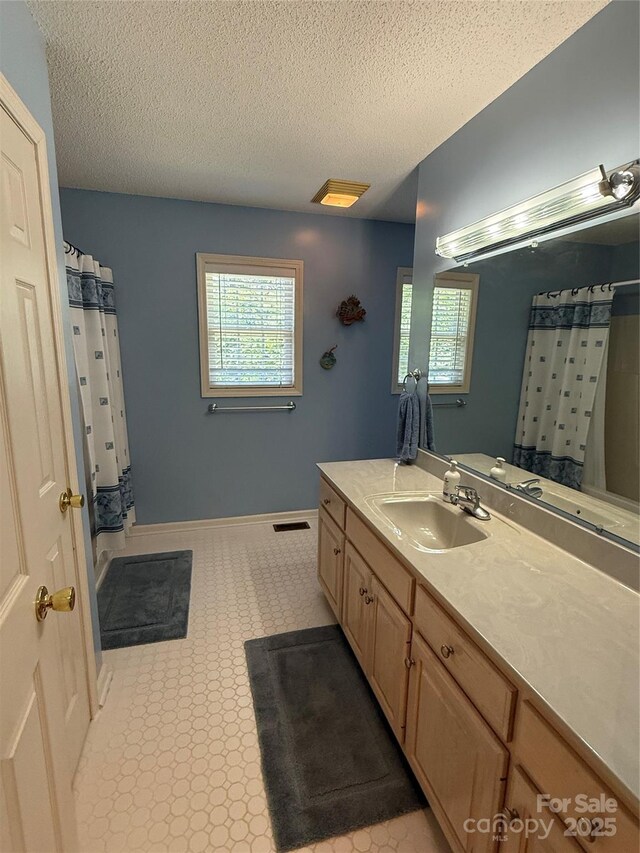 333 Lentz Landing Ln, Nebo, NC 28761 - full bath featuring vanity, a textured ceiling, and a shower with shower curtain