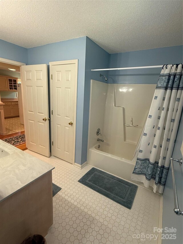 333 Lentz Landing Ln, Nebo, NC 28761 - bathroom with shower / bathtub combination with curtain, vanity, and a textured ceiling