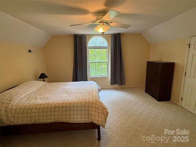 333 Lentz Landing Ln, Nebo, NC 28761 - bedroom with lofted ceiling, light colored carpet, a ceiling fan, and a textured ceiling