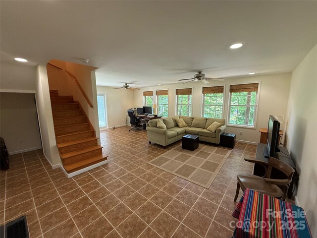333 Lentz Landing Ln, Nebo, NC 28761 - living room featuring dark tile patterned flooring, plenty of natural light, stairway, recessed lighting, and ceiling fan