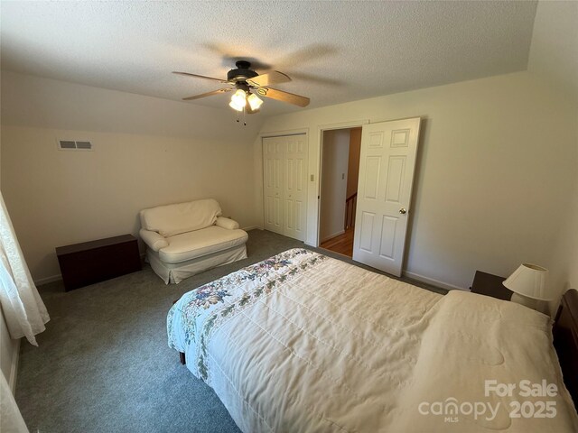 333 Lentz Landing Ln, Nebo, NC 28761 - bedroom featuring dark colored carpet, a textured ceiling, a closet, and ceiling fan