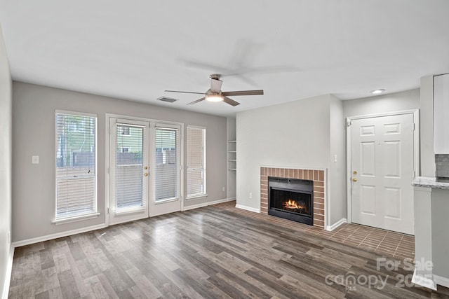 409 W 8th St Unit B, Charlotte, NC 28202 - unfurnished living room featuring wood finished floors, a ceiling fan, baseboards, a fireplace, and recessed lighting