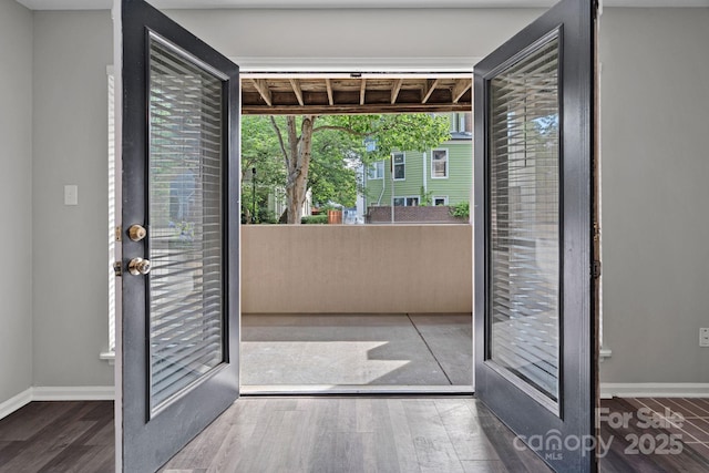 409 W 8th St Unit B, Charlotte, NC 28202 - doorway to outside featuring wood finished floors and baseboards