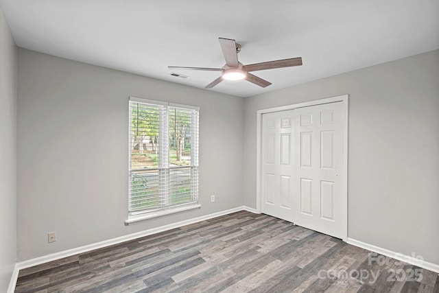 409 W 8th St Unit B, Charlotte, NC 28202 - unfurnished bedroom with wood finished floors, a closet, baseboards, and a ceiling fan