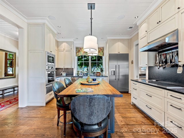 3 Bayonne Trl, Asheville, NC 28804 - kitchen featuring built in appliances, under cabinet range hood, a warming drawer, recessed lighting, and decorative backsplash
