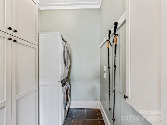 3 Bayonne Trl, Asheville, NC 28804 - laundry room featuring cabinet space, stacked washer and clothes dryer, and baseboards