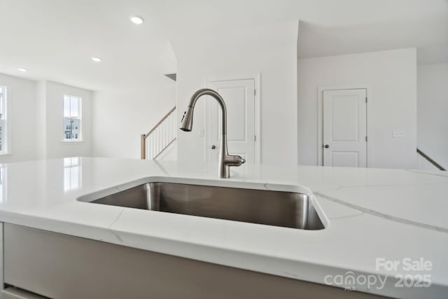 9214 Delancey Ln Unit 62, Concord, NC 28027 - kitchen view of a sink, light stone countertops, and recessed lighting