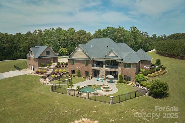 109 Oak Forest Dr, Kings Mountain, NC 28086 - rear view of house with a balcony, a patio area, a pool with connected hot tub, and a forest view