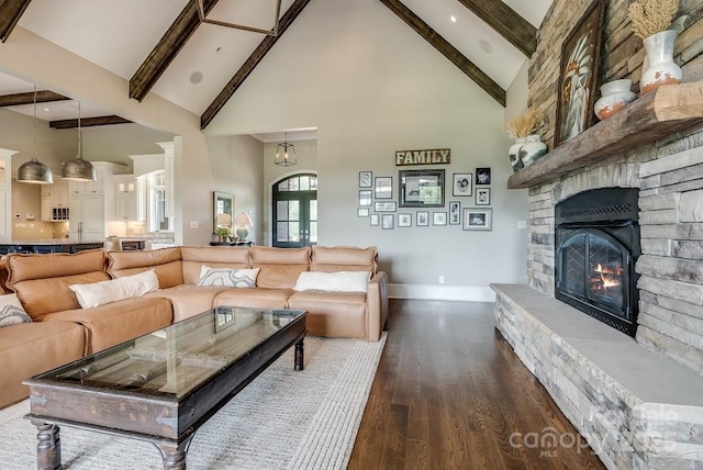 109 Oak Forest Dr, Kings Mountain, NC 28086 - living room featuring high vaulted ceiling, baseboards, beam ceiling, a fireplace, and dark wood-style floors