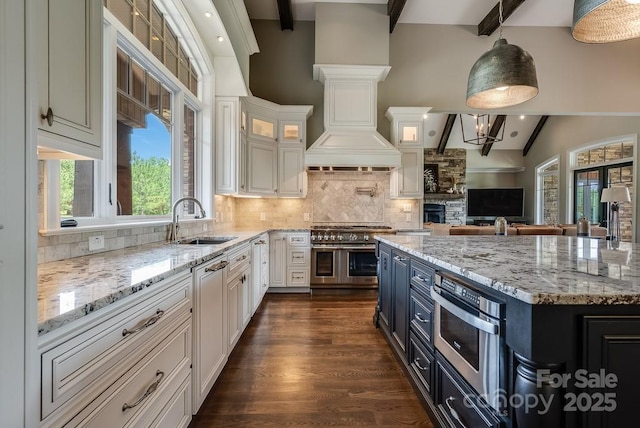 109 Oak Forest Dr, Kings Mountain, NC 28086 - kitchen featuring double oven range, a sink, white cabinetry, and backsplash
