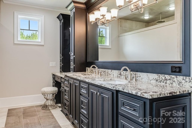 109 Oak Forest Dr, Kings Mountain, NC 28086 - bathroom with double vanity, a chandelier, ornamental molding, and baseboards
