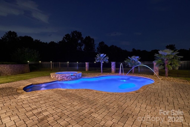 109 Oak Forest Dr, Kings Mountain, NC 28086 - pool at night with a fenced backyard, a patio, and a pool with connected hot tub