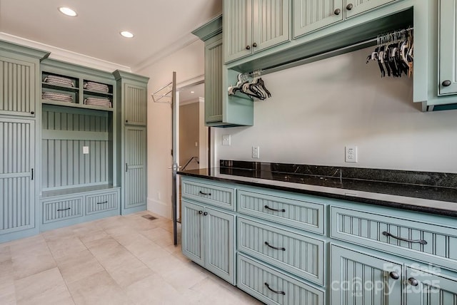 109 Oak Forest Dr, Kings Mountain, NC 28086 - kitchen with green cabinets, ornamental molding, recessed lighting, and dark stone counters