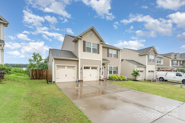 189 Fesperman Cir, Troutman, NC 28166 - view of front of house with board and batten siding, driveway, and a residential view