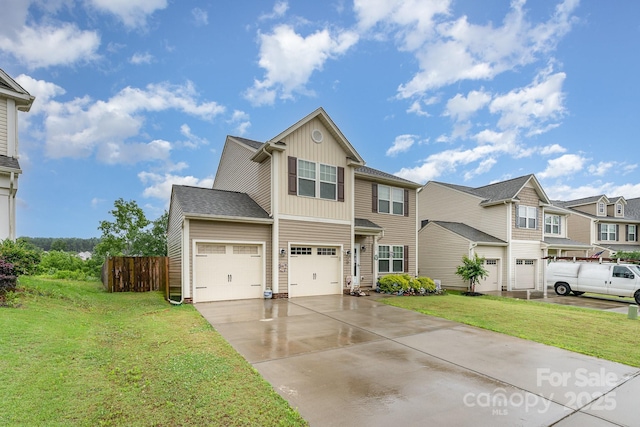 189 Fesperman Cir, Troutman, NC 28166 - view of front facade with board and batten siding, concrete driveway, and a residential view