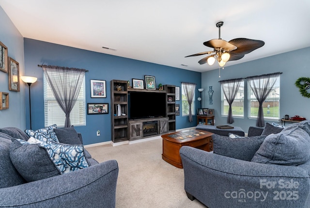 189 Fesperman Cir, Troutman, NC 28166 - carpeted living room featuring ceiling fan and baseboards