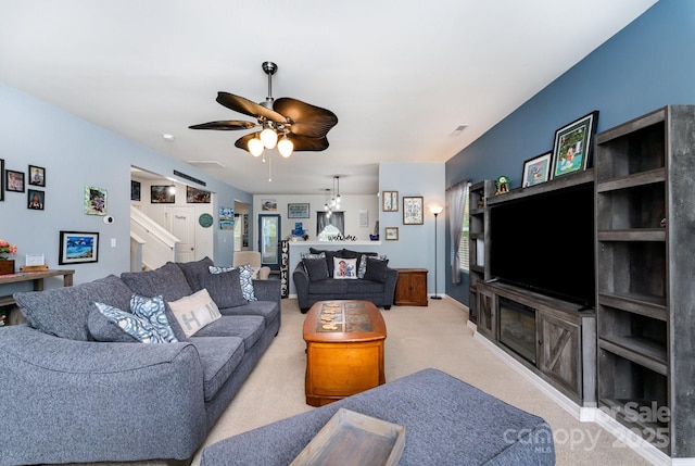 189 Fesperman Cir, Troutman, NC 28166 - living area with carpet, stairway, and ceiling fan