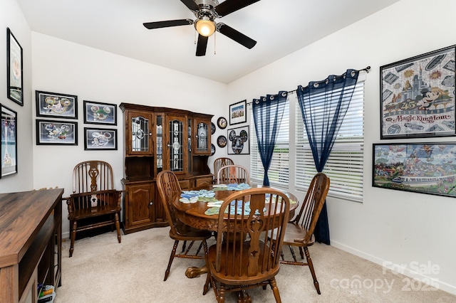 189 Fesperman Cir, Troutman, NC 28166 - dining room with light colored carpet, ceiling fan, and baseboards