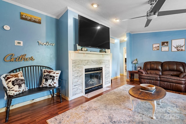 5366 Hayes Waters Rd, Morganton, NC 28655 - living room with crown molding, wood finished floors, ceiling fan, and a fireplace