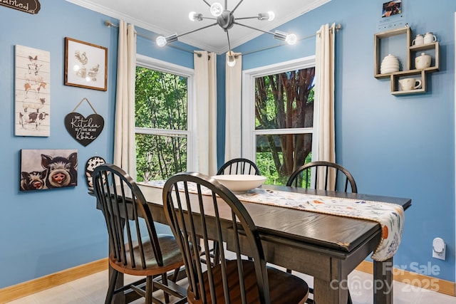 5366 Hayes Waters Rd, Morganton, NC 28655 - dining area with crown molding, a chandelier, and baseboards