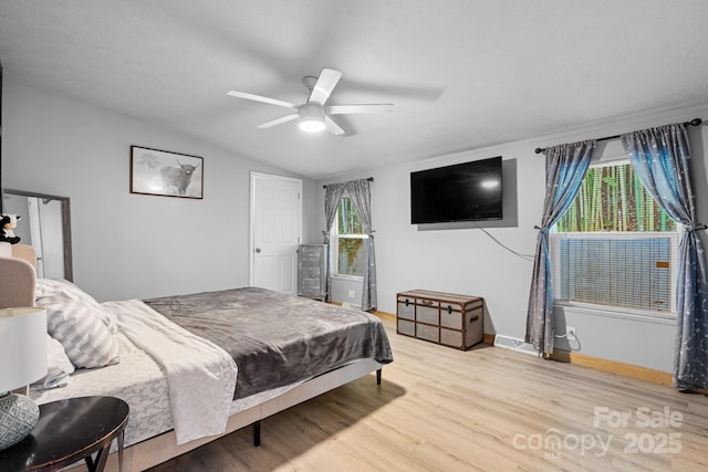 5366 Hayes Waters Rd, Morganton, NC 28655 - bedroom with wood finished floors, vaulted ceiling, and a ceiling fan