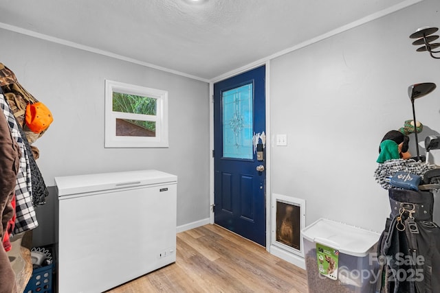 5366 Hayes Waters Rd, Morganton, NC 28655 - laundry room featuring light wood-style flooring, baseboards, and crown molding