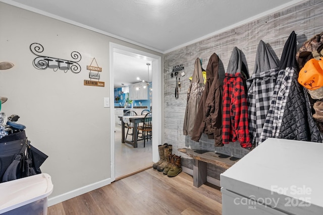 5366 Hayes Waters Rd, Morganton, NC 28655 - mudroom featuring wood finished floors, crown molding, and baseboards