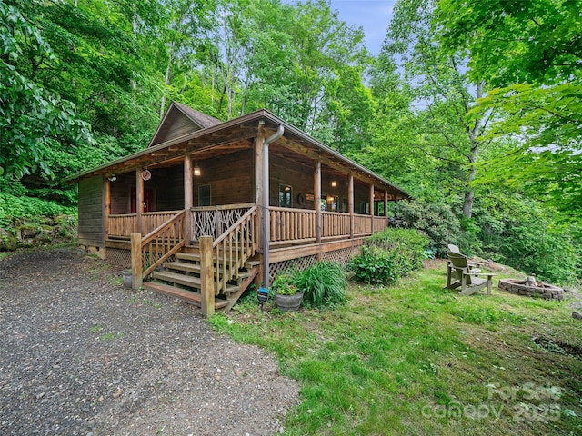 198 Bear Ridge Rd, Bakersville, NC 28705 - view of front of house with an outdoor fire pit, a porch, and stairway