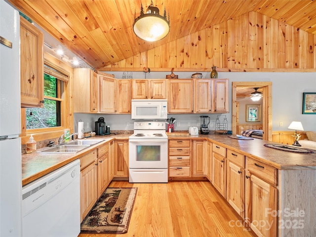 198 Bear Ridge Rd, Bakersville, NC 28705 - kitchen featuring white appliances, vaulted ceiling, light brown cabinetry, a sink, and light wood-style flooring