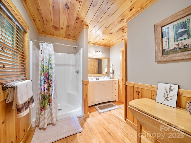 198 Bear Ridge Rd, Bakersville, NC 28705 - full bathroom with a wainscoted wall, wood finished floors, curtained shower, vanity, and wooden ceiling