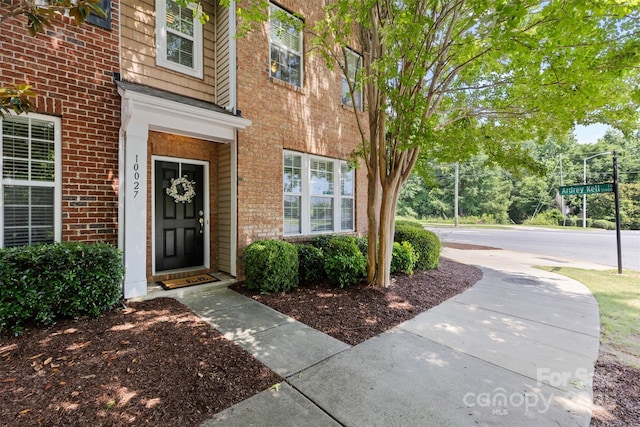 10027 Juniper Trace Dr, Charlotte, NC 28277 - doorway to property featuring brick siding