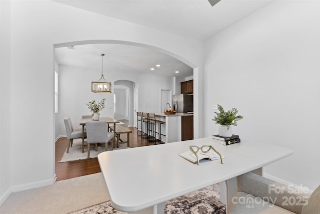 10027 Juniper Trace Dr, Charlotte, NC 28277 - dining room featuring arched walkways, baseboards, recessed lighting, and dark carpet