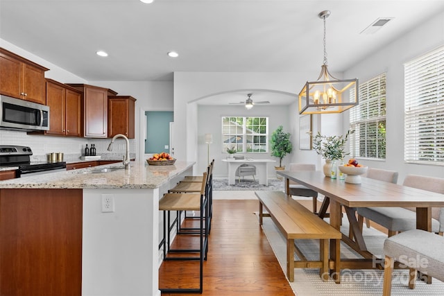 10027 Juniper Trace Dr, Charlotte, NC 28277 - kitchen featuring appliances with stainless steel finishes, a sink, a ceiling fan, dark wood-type flooring, and recessed lighting