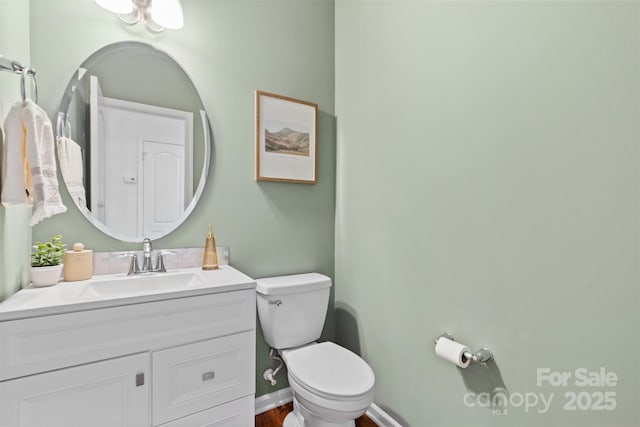 10027 Juniper Trace Dr, Charlotte, NC 28277 - half bathroom with toilet, vanity, baseboards, and wood finished floors