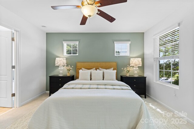 10027 Juniper Trace Dr, Charlotte, NC 28277 - bedroom with light carpet, baseboards, and a ceiling fan