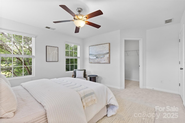 10027 Juniper Trace Dr, Charlotte, NC 28277 - bedroom featuring light colored carpet, baseboards, a spacious closet, ceiling fan, and a closet