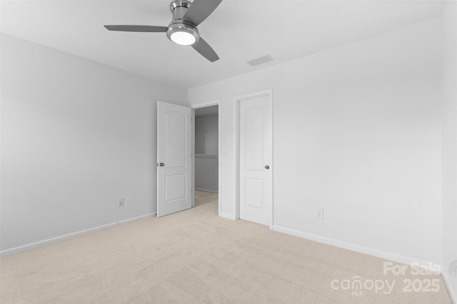 10027 Juniper Trace Dr, Charlotte, NC 28277 - unfurnished bedroom featuring light carpet, baseboards, and ceiling fan