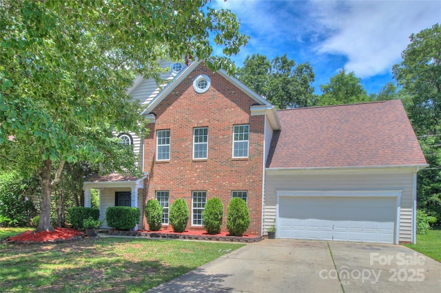 6310 Trevor Simpson Dr, Indian Trail, NC 28079 - traditional-style home with concrete driveway, an attached garage, brick siding, and a front yard