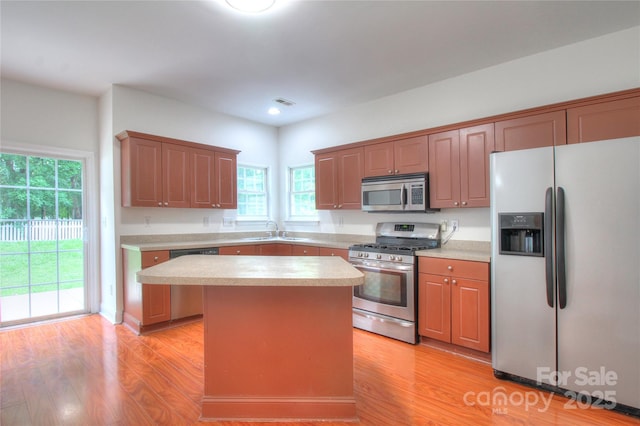 6310 Trevor Simpson Dr, Indian Trail, NC 28079 - kitchen featuring stainless steel appliances, light wood-style floors, a sink, light countertops, and recessed lighting