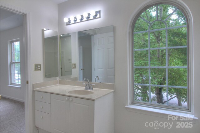 6310 Trevor Simpson Dr, Indian Trail, NC 28079 - bathroom with vanity and baseboards