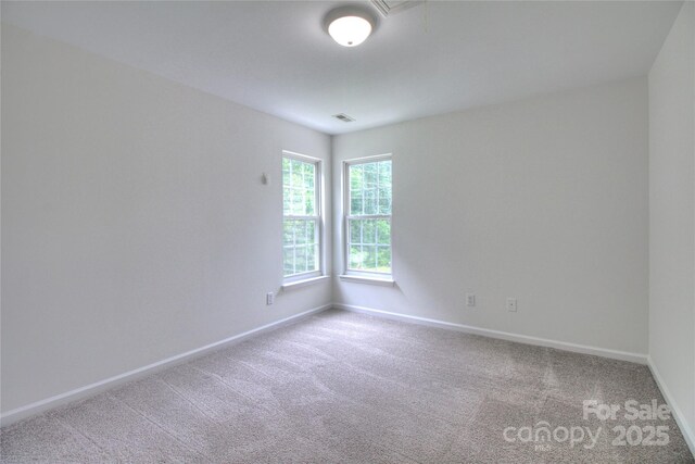 6310 Trevor Simpson Dr, Indian Trail, NC 28079 - empty room featuring baseboards, carpet, and attic access