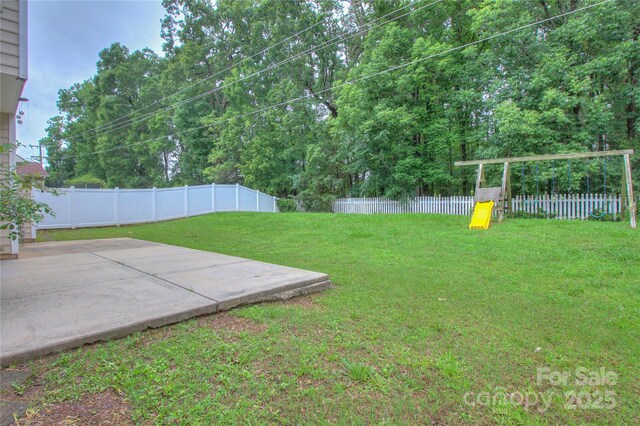 6310 Trevor Simpson Dr, Indian Trail, NC 28079 - view of yard featuring a playground and a patio area